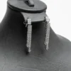 Boucles d'oreilles pendantes parure Queues de lumière pavées de zircons blancs cristaux acier argenté