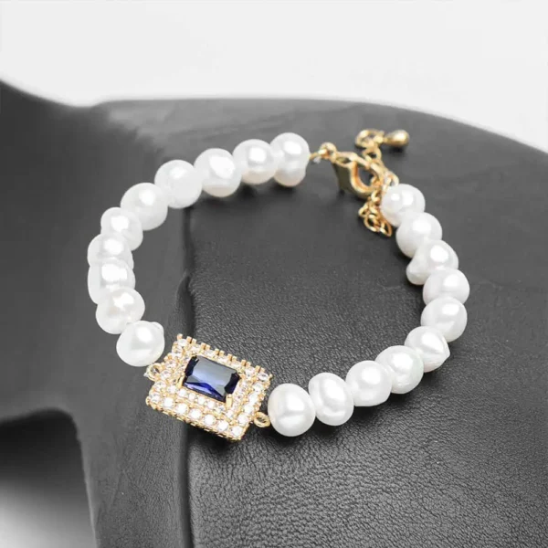 Bracelet parure Cœur d'océan perles blanches zircon bleu acier doré