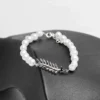 Bracelet parure La plume d'obsidienne perles d'eau douce zircons noirs acier