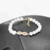 Bracelet parure L'infini doré perles d'eau douce symbole infini zircons finition dorée
