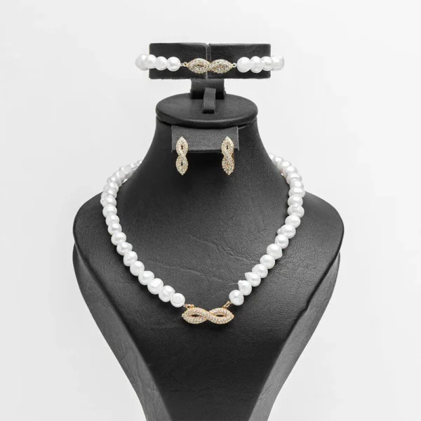 Parure complète L'infini doré perles d'eau douce zircons finition dorée acier inoxydable