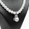 Collier pendentif perle blanche acier inoxydable avec ornements perle