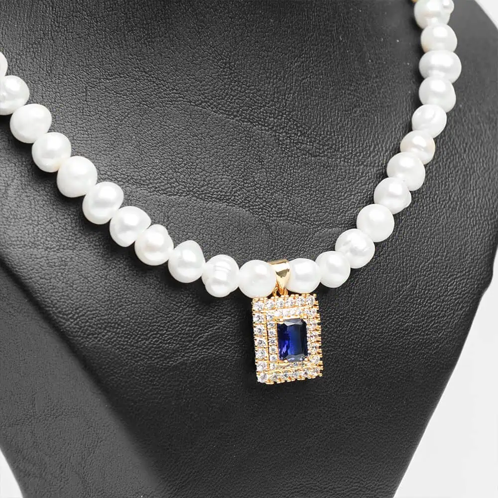 Collier pendentif parure Cœur d'océan perles blanches zircon bleu acier